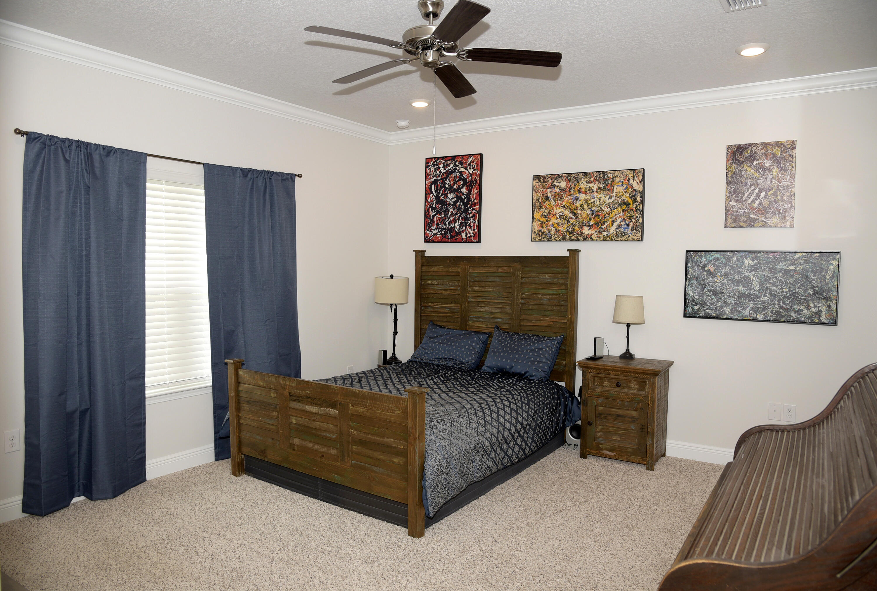 328 Lightning Bug Lane Freeport, FL 32439 - Photo 22 of 43 a bedroom with furniture and a chandelier