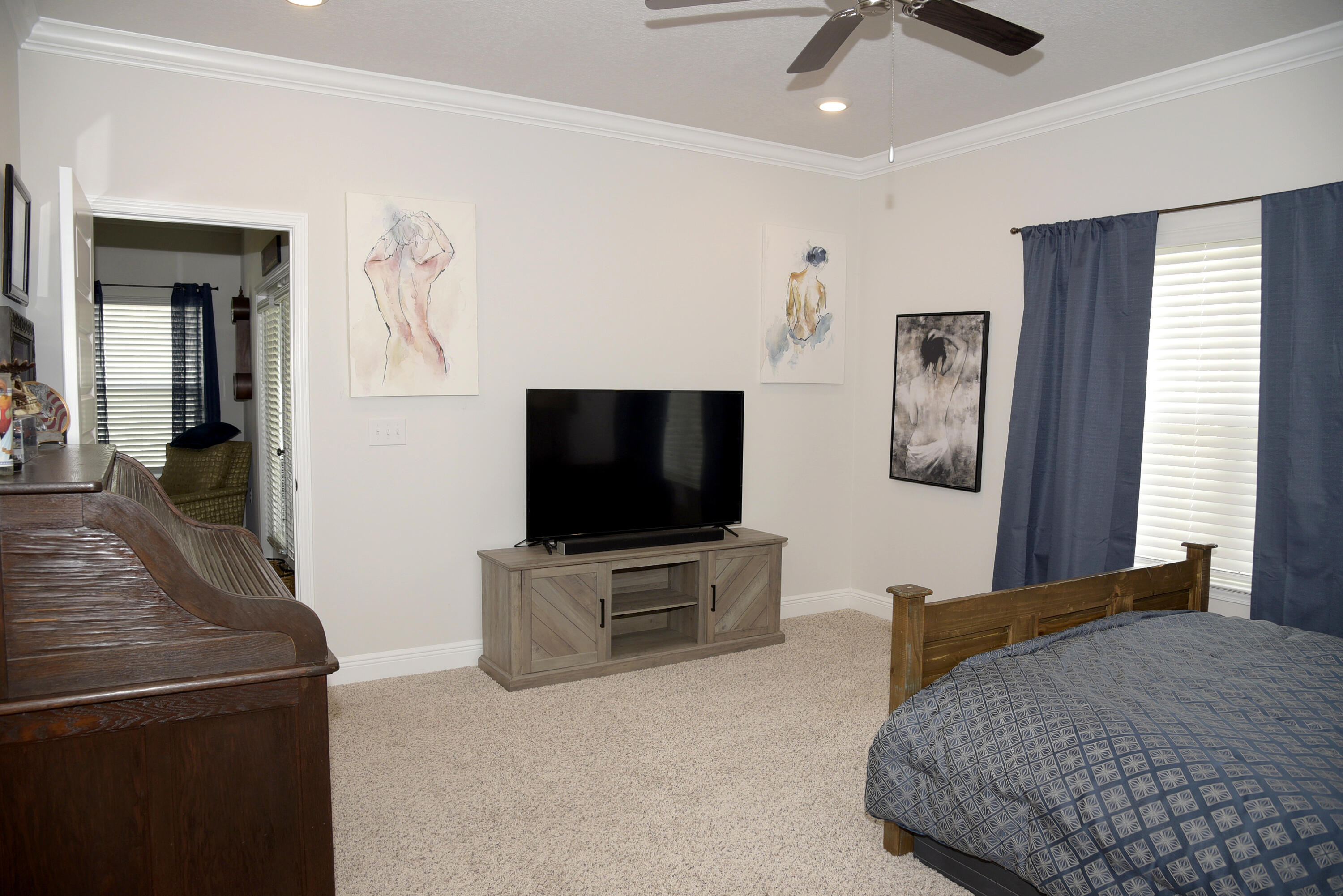 328 Lightning Bug Lane Freeport, FL 32439 - Photo 23 of 43 a bedroom with furniture and a flat screen tv