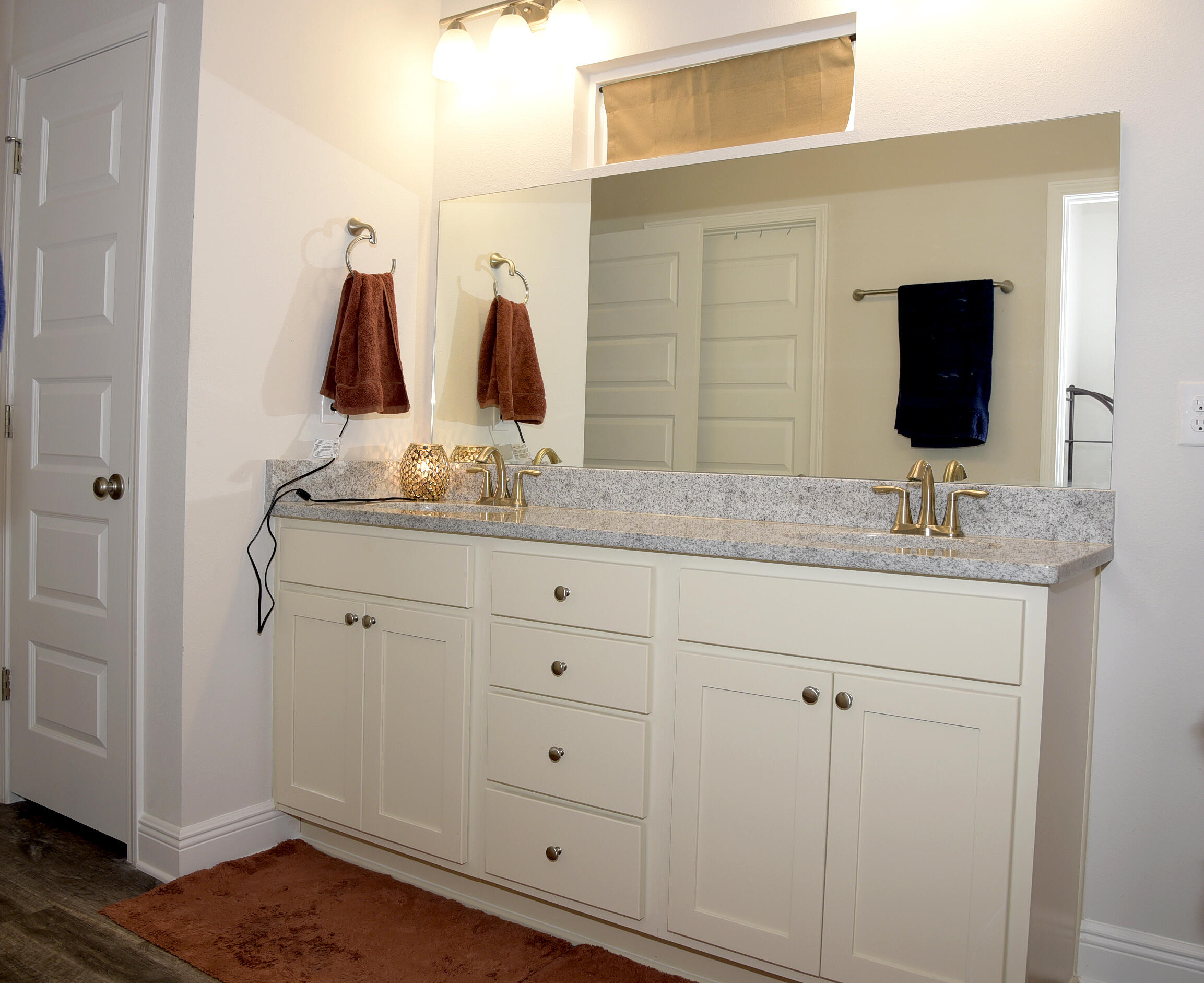 328 Lightning Bug Lane Freeport, FL 32439 - Photo 25 of 43 a bathroom with a double vanity sink and mirror