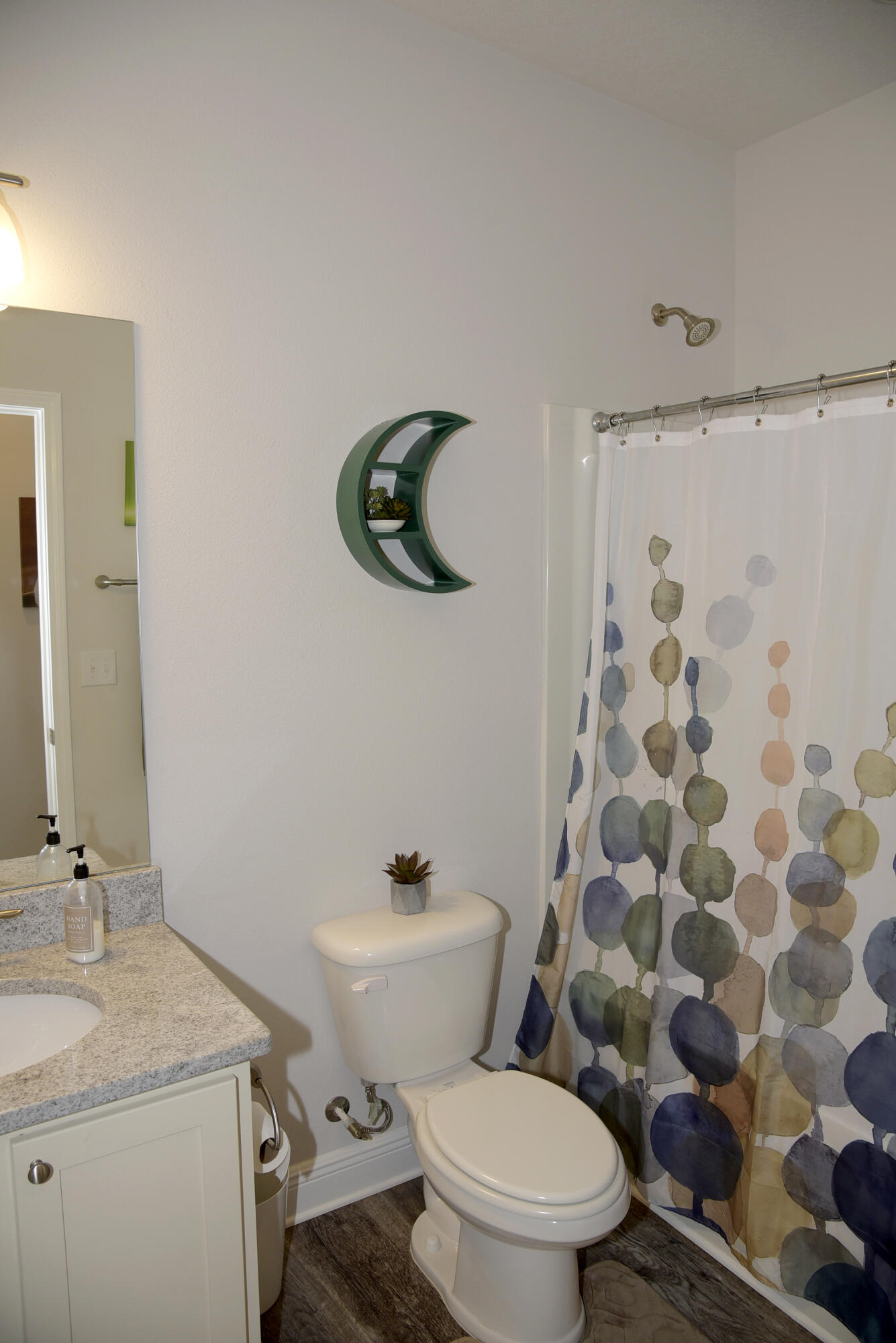 328 Lightning Bug Lane Freeport, FL 32439 - Photo 32 of 43 a bathroom with a sink toilet and shower