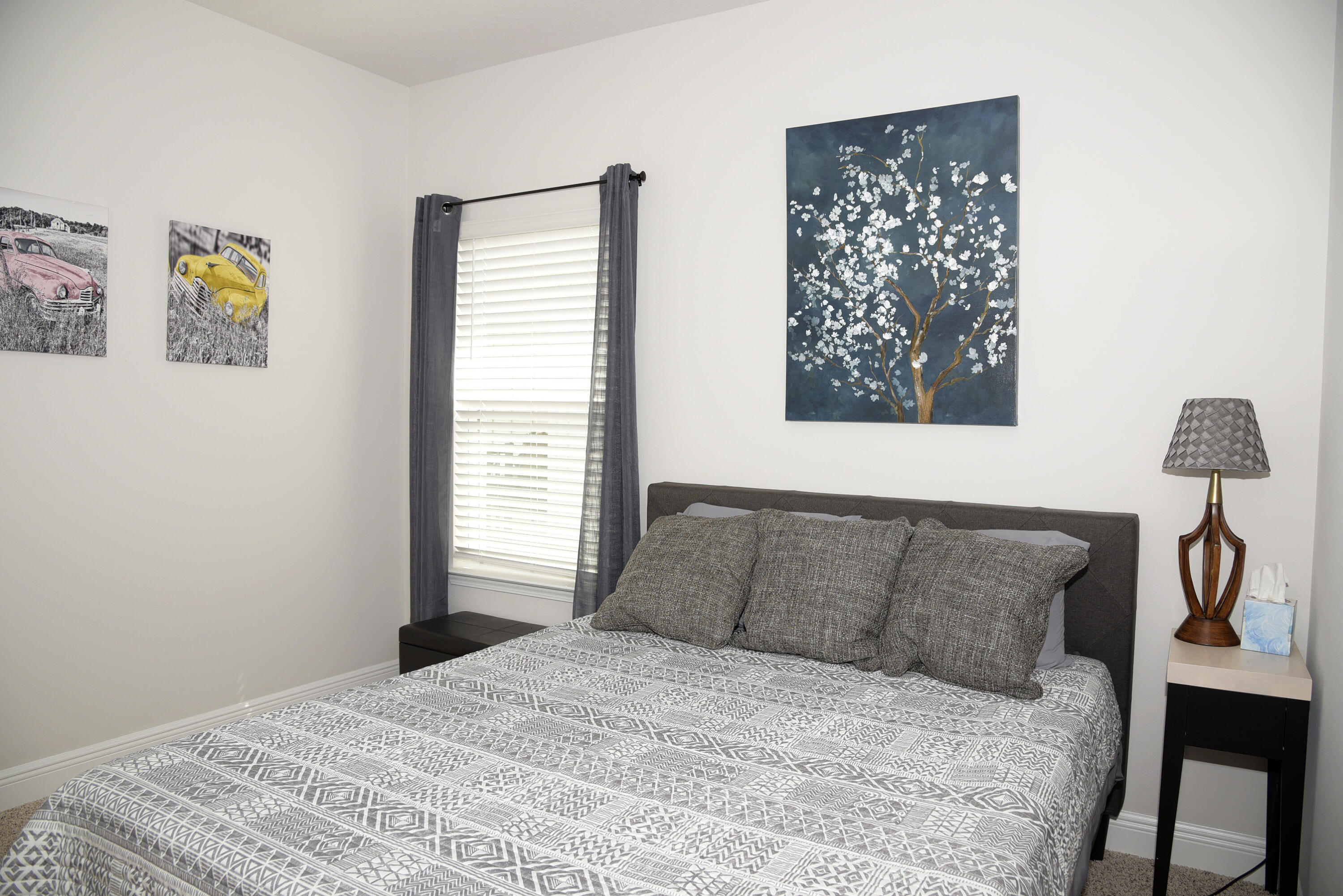 328 Lightning Bug Lane Freeport, FL 32439 - Photo 34 of 43 a bedroom with a bed and a window