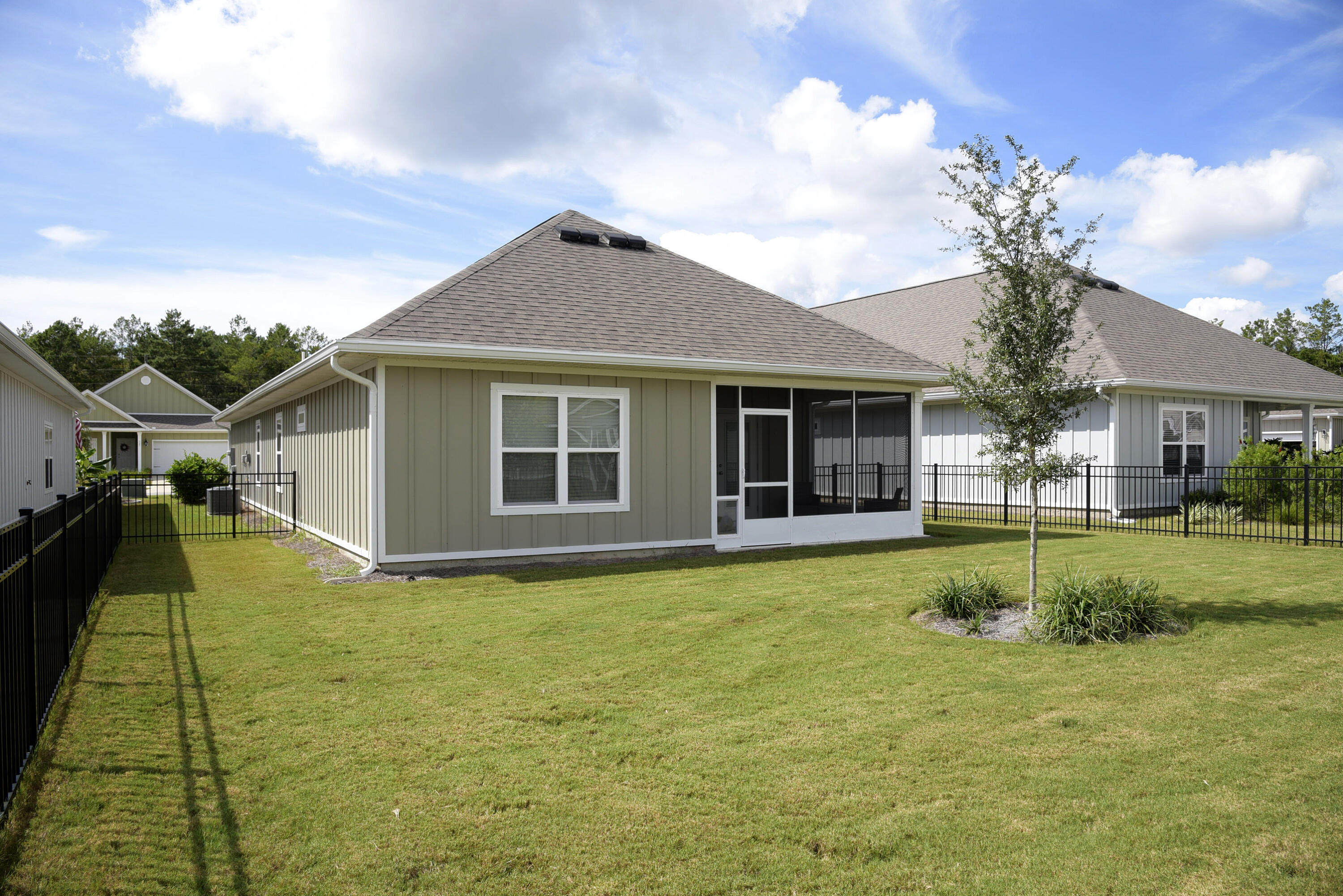 328 Lightning Bug Lane Freeport, FL 32439 - Photo 41 of 43 a front view of a house with a yard
