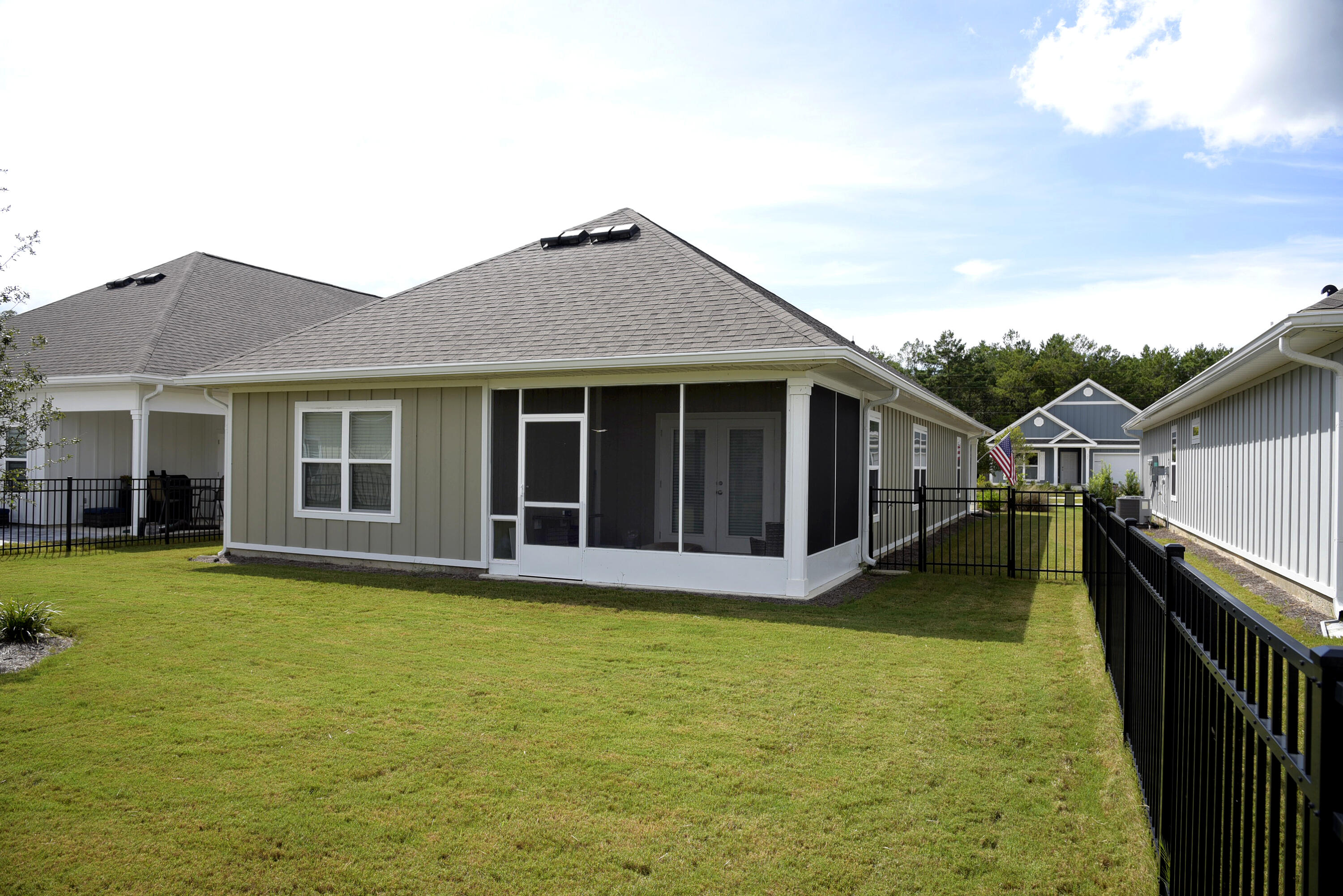 328 Lightning Bug Lane Freeport, FL 32439 - Photo 43 of 43 a view of a house with pool and yard with furniture