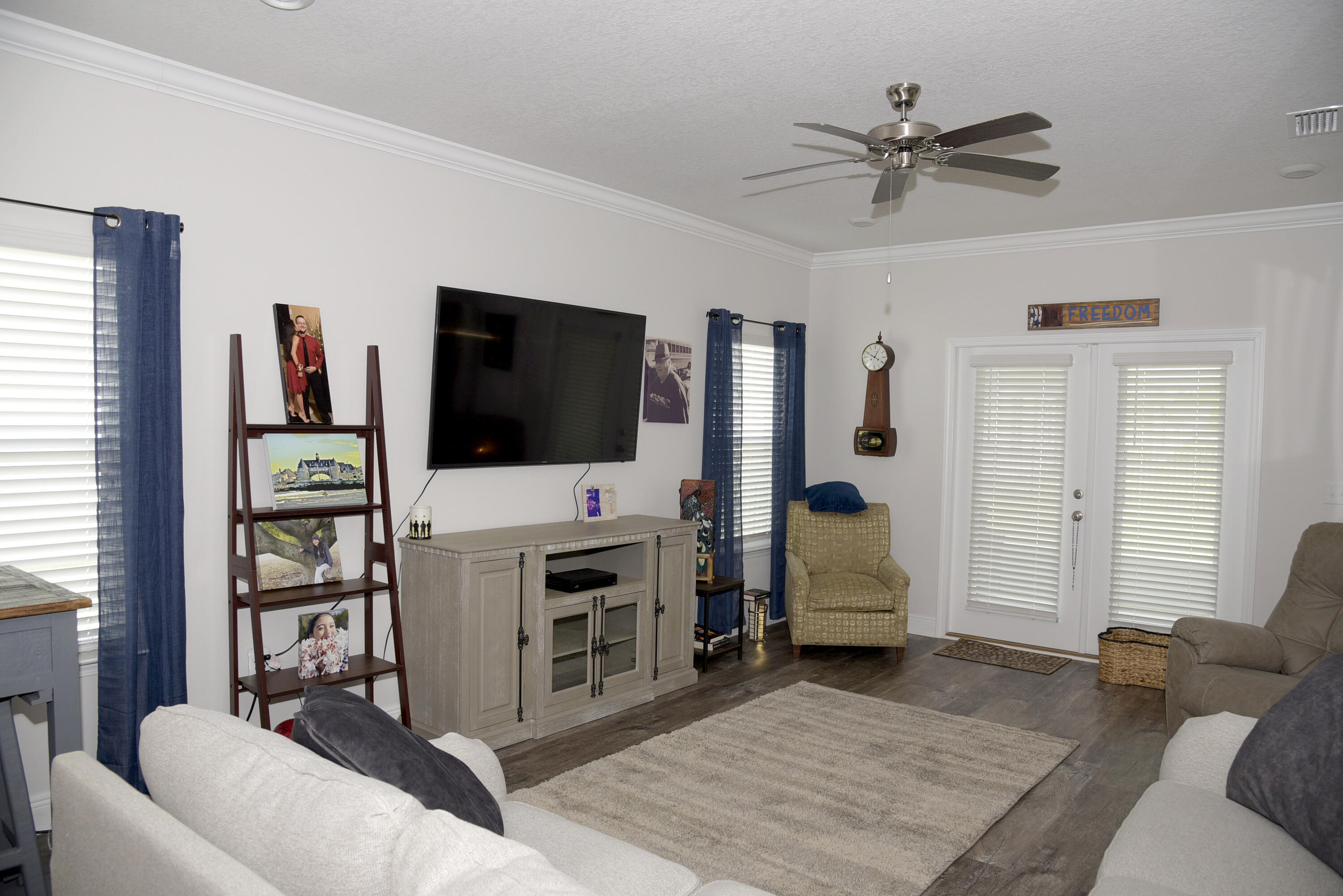 328 Lightning Bug Lane Freeport, FL 32439 - Photo 10 of 43 a living room with furniture and a flat screen tv