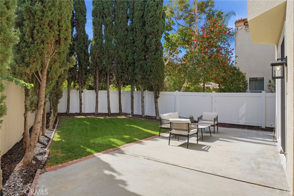 32 Comiso Irvine, CA 92614 - Photo 11 of 22 a view of backyard with a table and chairs