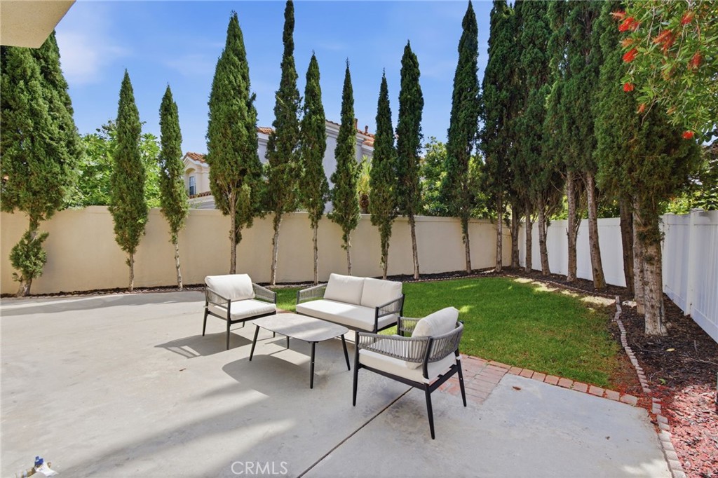 32 Comiso Irvine, CA 92614 - Photo 12 of 22 a row of palm trees sitting in a yard with swimming pool