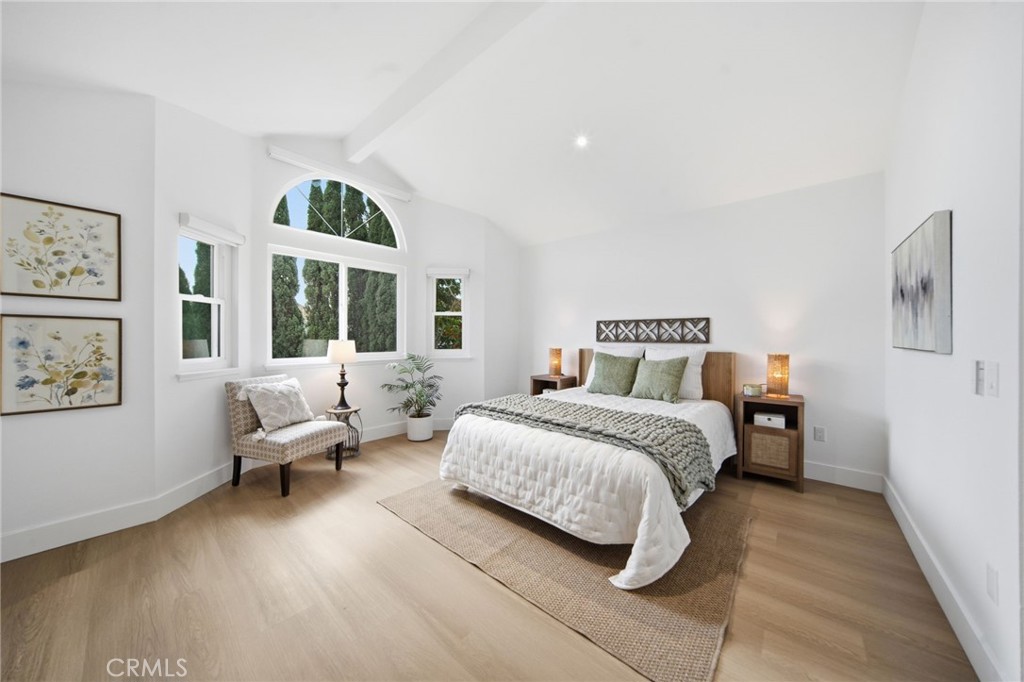 32 Comiso Irvine, CA 92614 - Photo 14 of 22 a bedroom with a bed couch and a large window