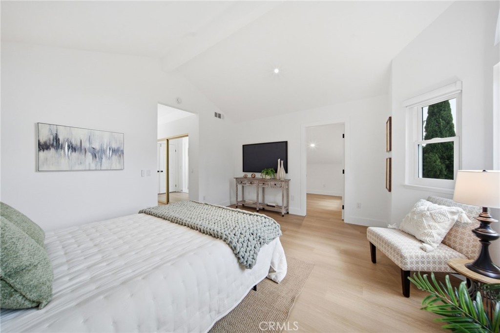 32 Comiso Irvine, CA 92614 - Photo 15 of 22 a spacious bedroom with a bed and a couch