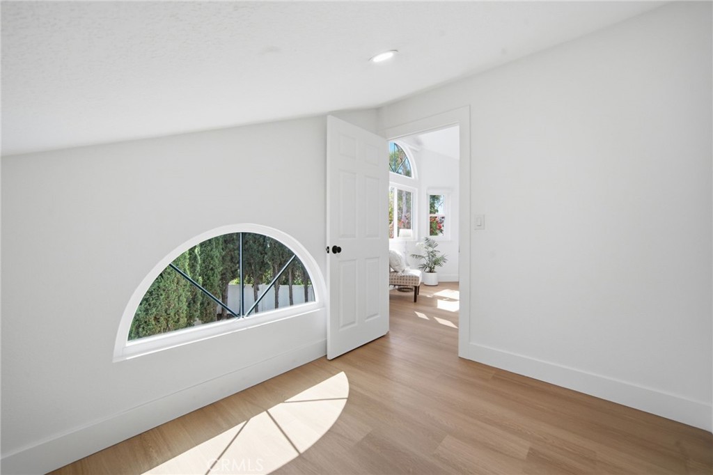 32 Comiso Irvine, CA 92614 - Photo 16 of 22 a view of an empty room and wooden floor