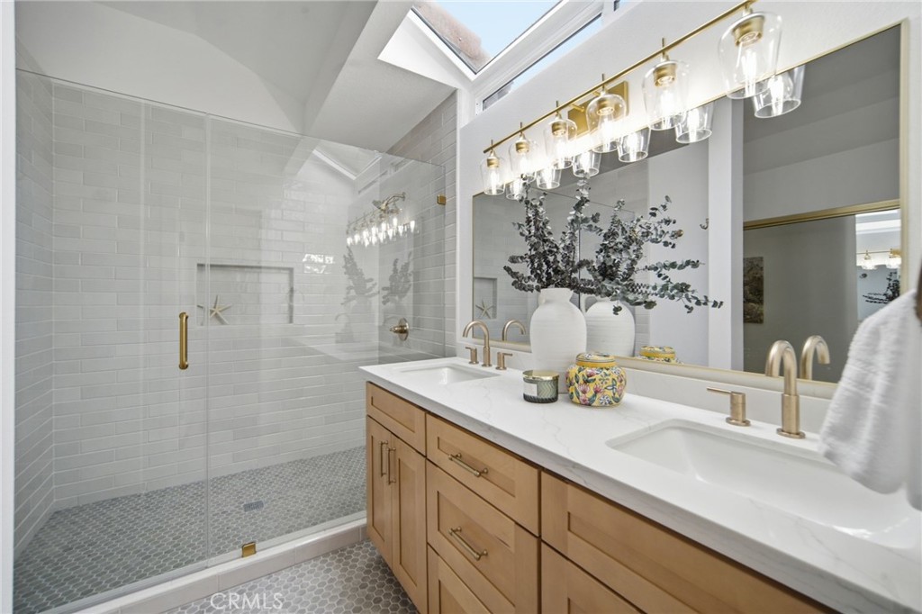 32 Comiso Irvine, CA 92614 - Photo 18 of 22 a bathroom with a sink and a mirror
