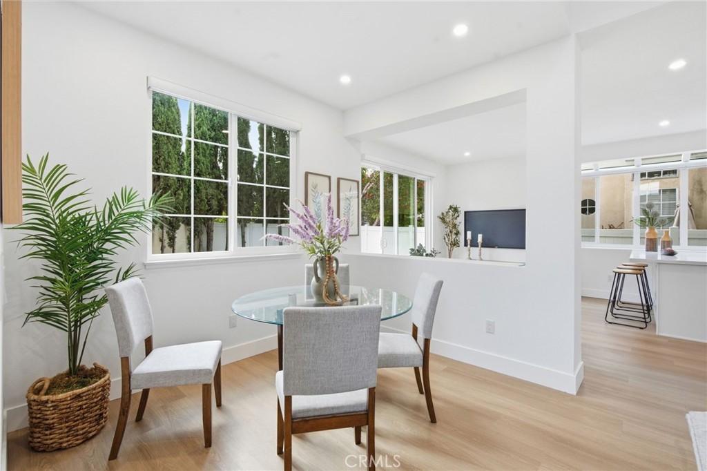 32 Comiso Irvine, CA 92614 - Photo 6 of 22 a view of a dining room with furniture and a potted plant