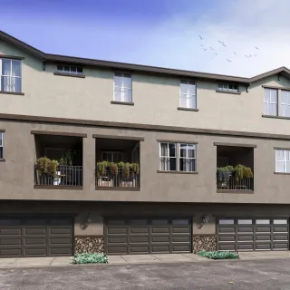 a front view of a house with large windows