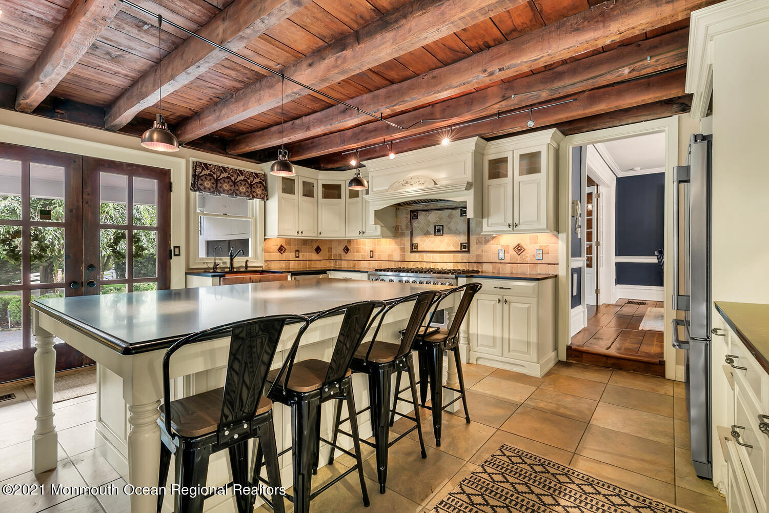60 Conover Road Colts Neck, NJ 07722 - Photo 13 of 44 a outdoor dining space with furniture and kitchen view