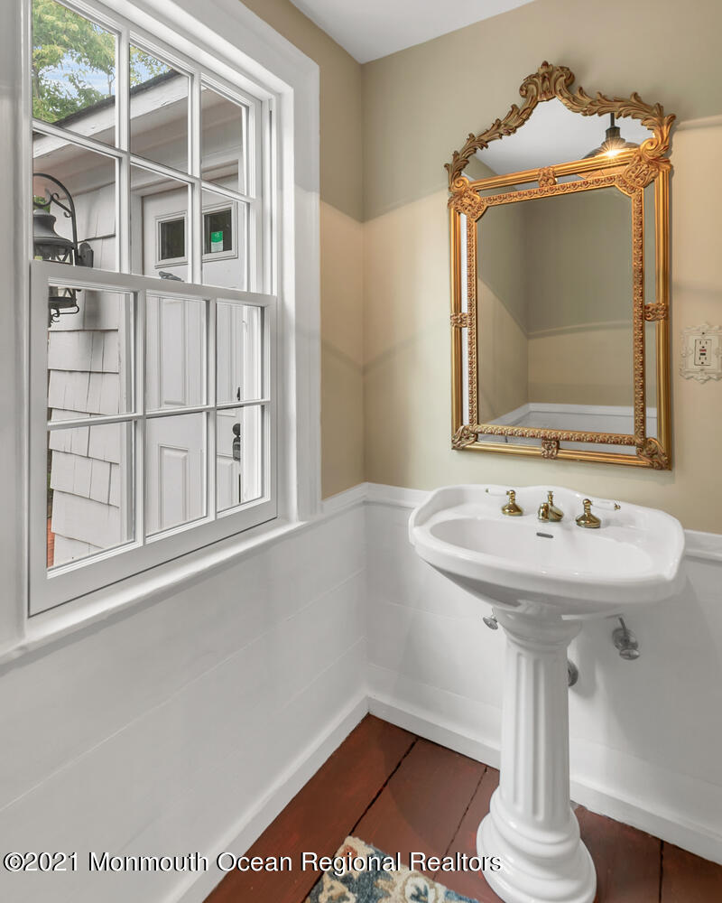 60 Conover Road Colts Neck, NJ 07722 - Photo 18 of 44 a bathroom with a sink and a mirror