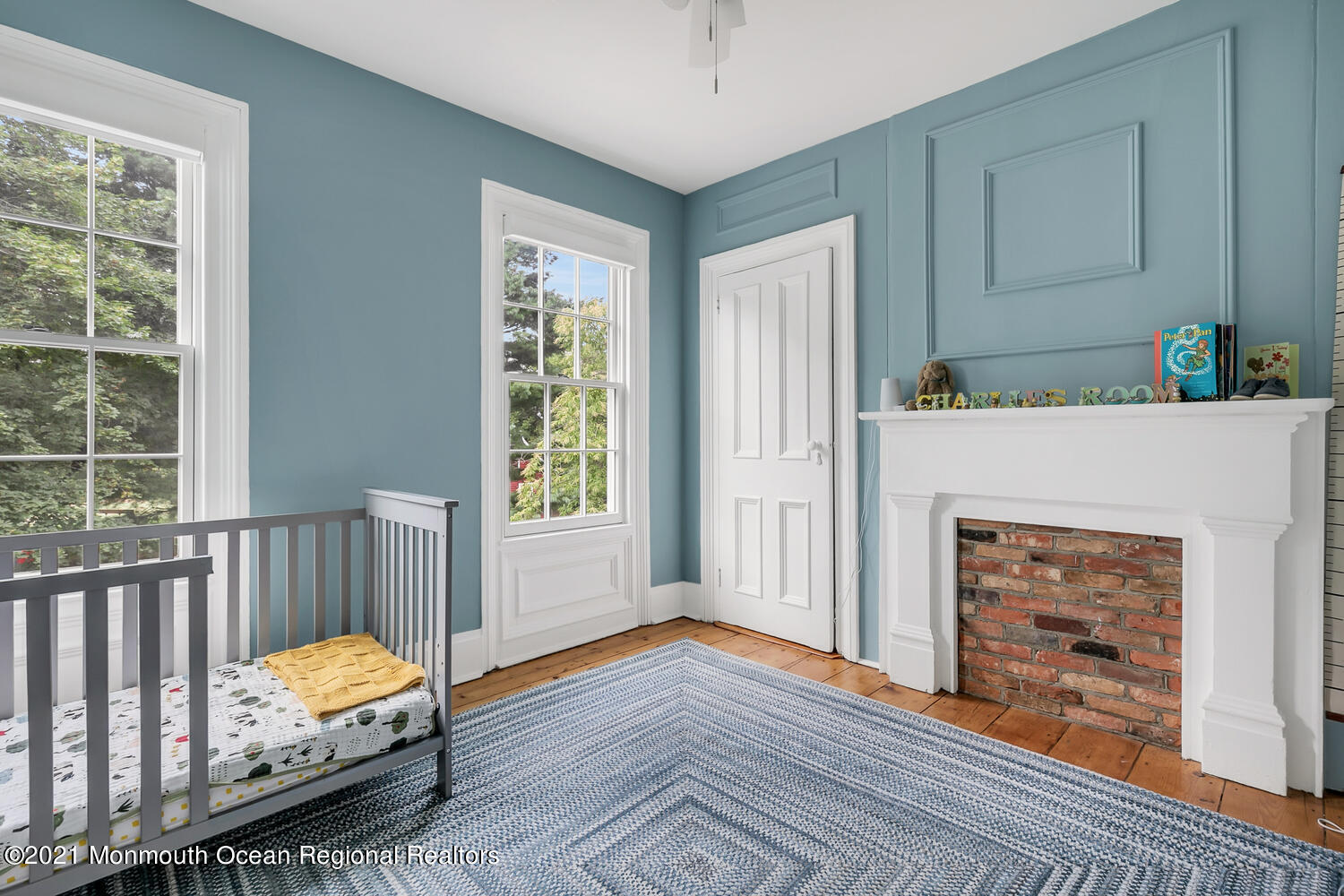 60 Conover Road Colts Neck, NJ 07722 - Photo 25 of 44 a bedroom with furniture and a fireplace