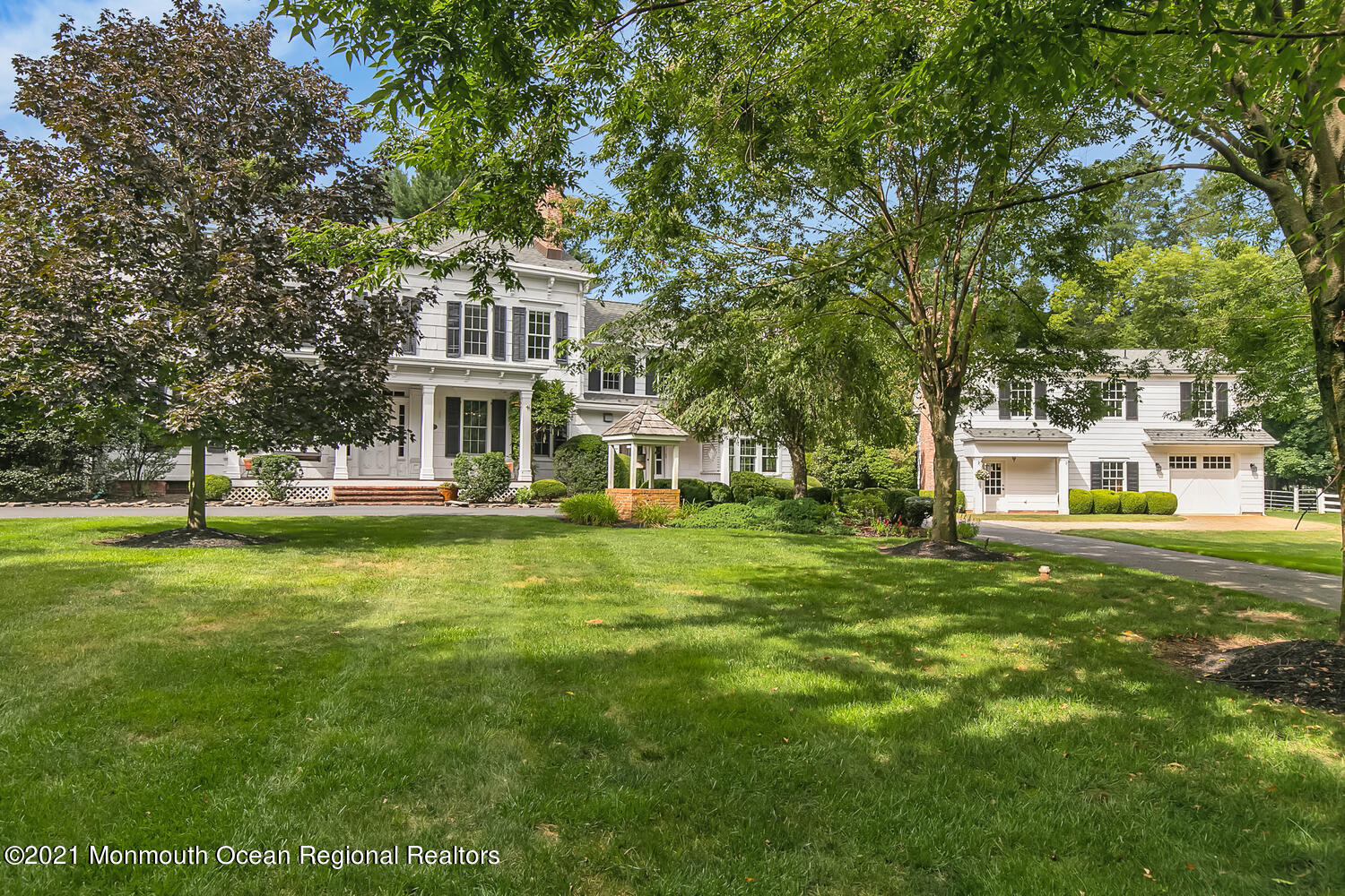 60 Conover Road Colts Neck, NJ 07722 - Photo 4 of 44 a front view of a house with a garden