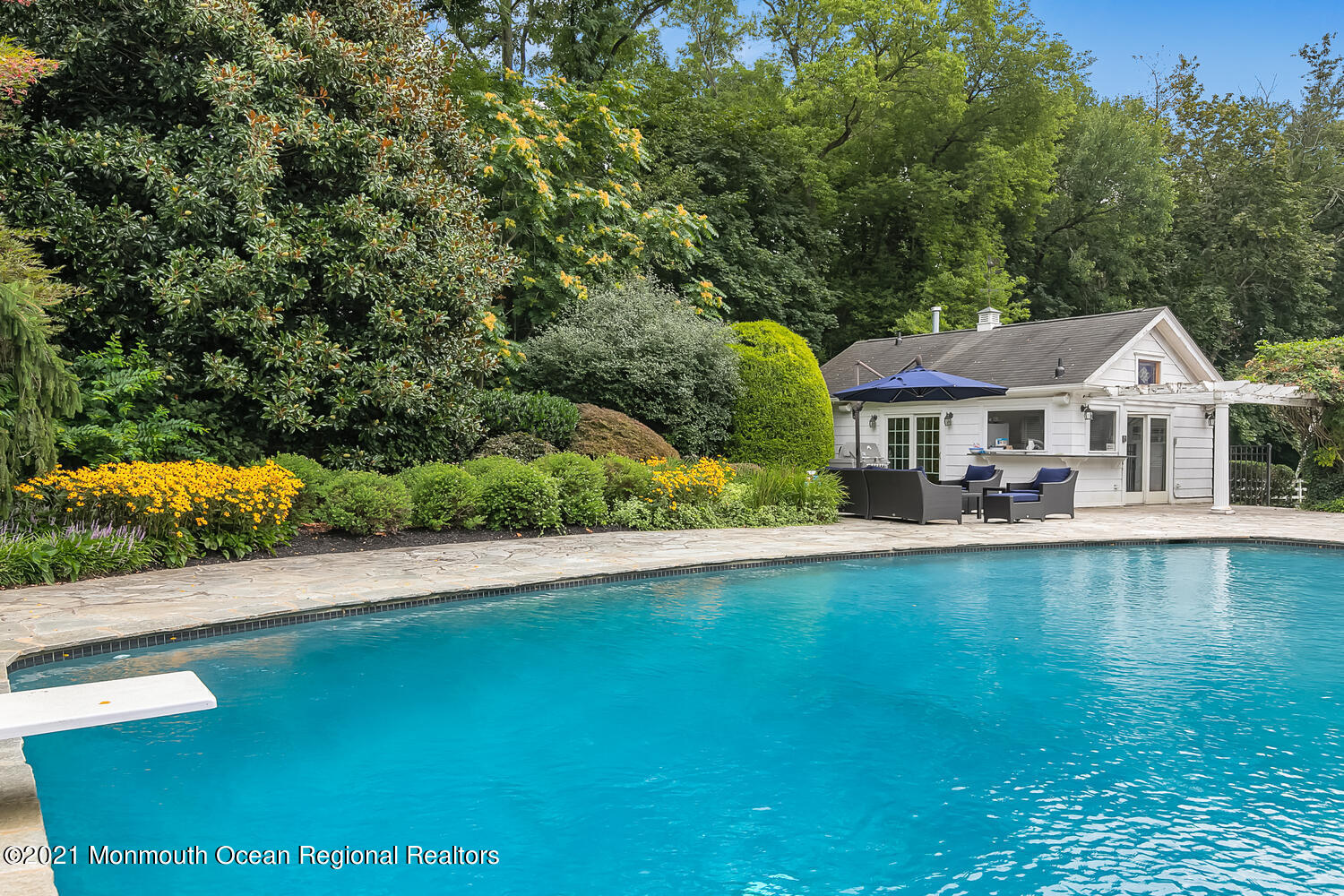 60 Conover Road Colts Neck, NJ 07722 - Photo 36 of 44 a front view of a house with swimming pool and a yard