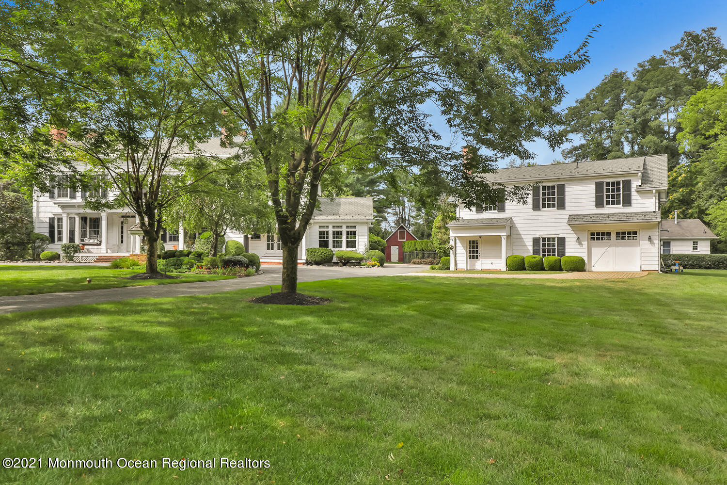 60 Conover Road Colts Neck, NJ 07722 - Photo 41 of 44 a front view of a house with a garden