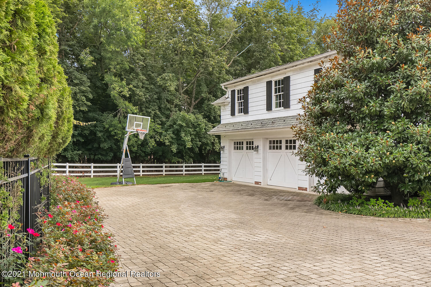 60 Conover Road Colts Neck, NJ 07722 - Photo 42 of 44 a view of a house with a yard and potted plants