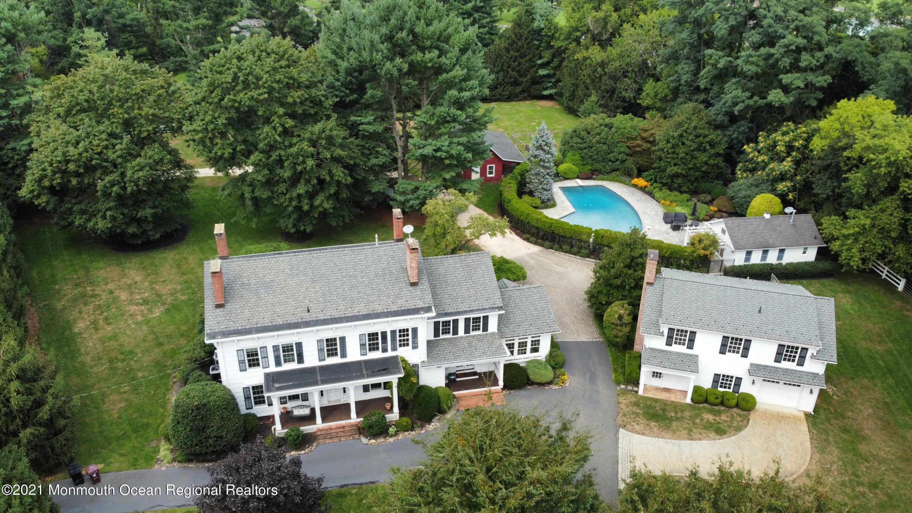 60 Conover Road Colts Neck, NJ 07722 - Photo 44 of 44 an aerial view of a house with outdoor space pool tennis court and yard
