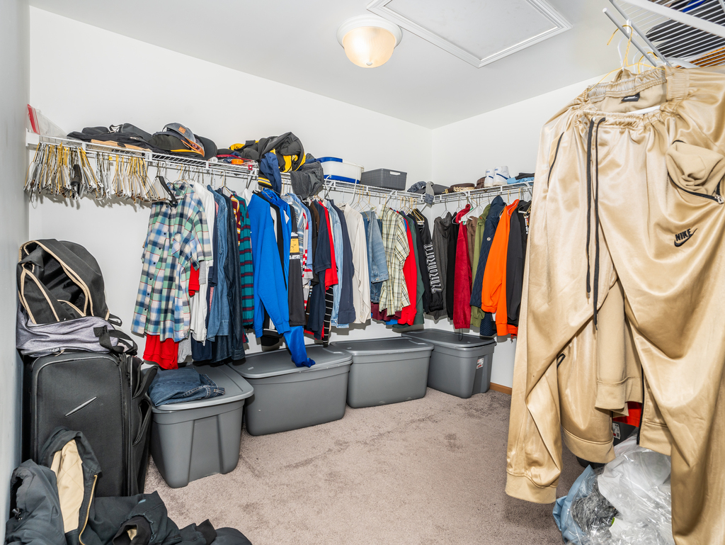 816 Kennedy Street Waterman, IL 60556 - Photo 15 of 27 a view of walk in closet with clothes and shoes