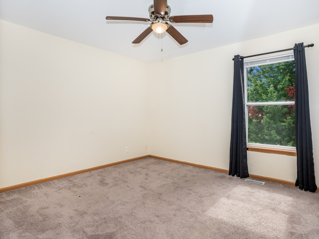 816 Kennedy Street Waterman, IL 60556 - Photo 19 of 27 an empty room with chandelier fan