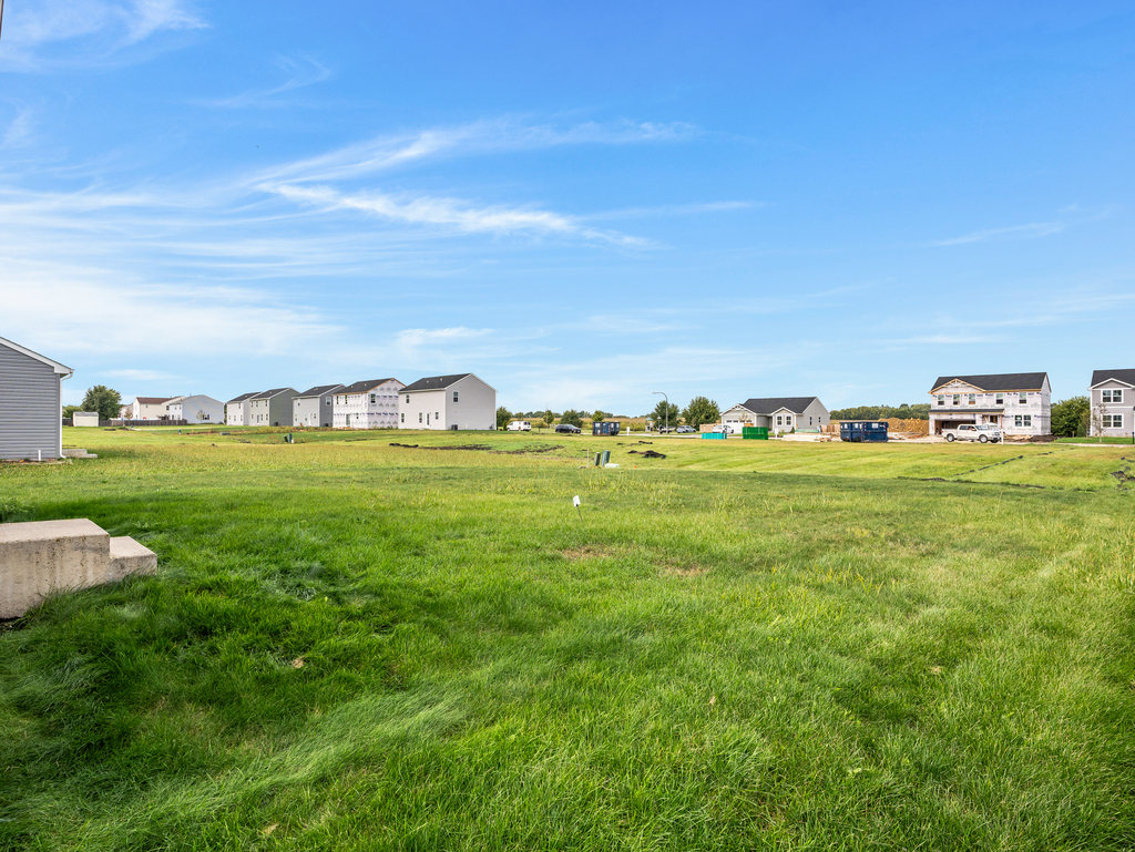 816 Kennedy Street Waterman, IL 60556 - Photo 26 of 27 a view of a grassy field with an trees