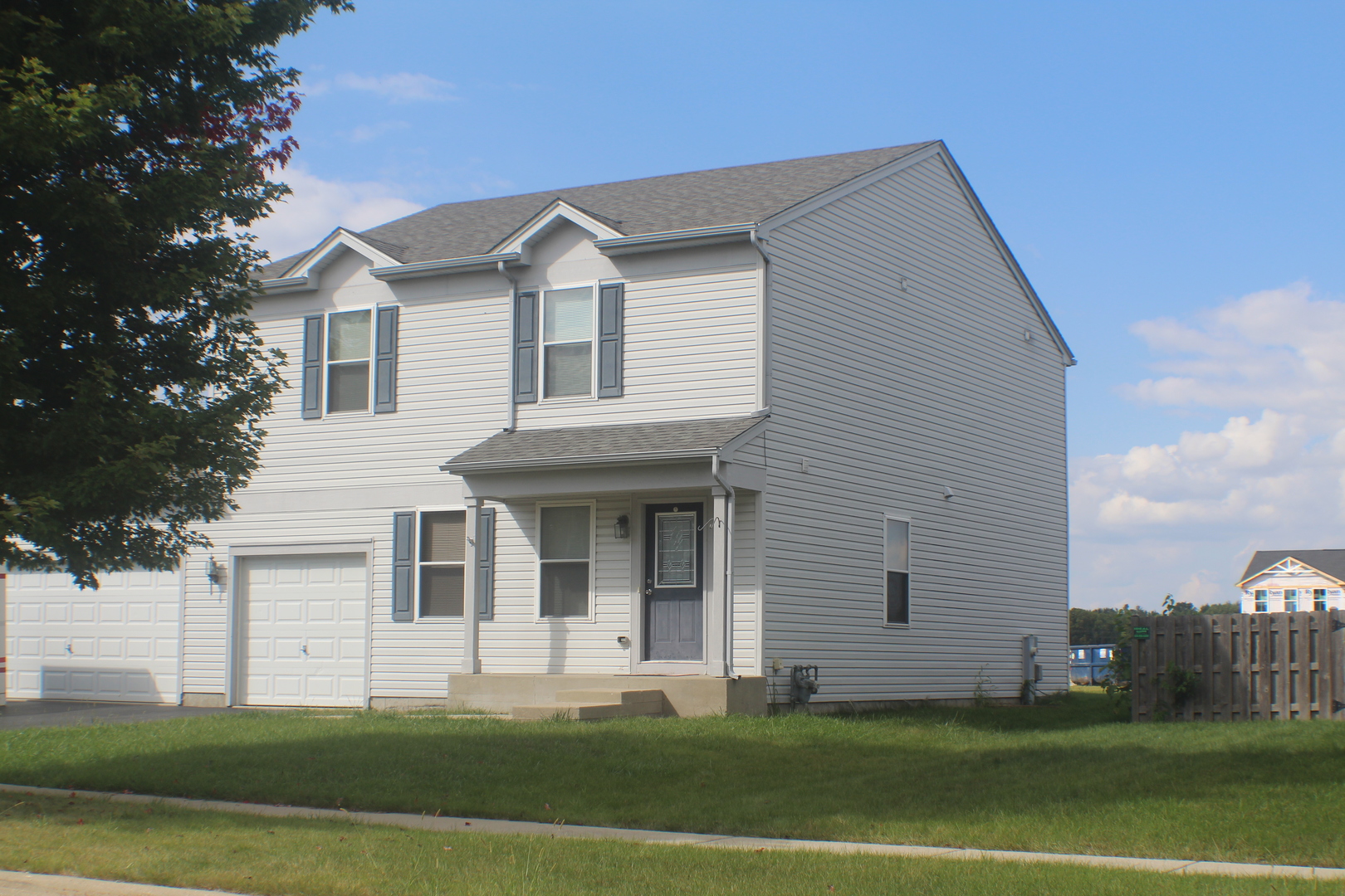 816 Kennedy Street Waterman, IL 60556 - Photo 27 of 27 a front view of a house with a yard