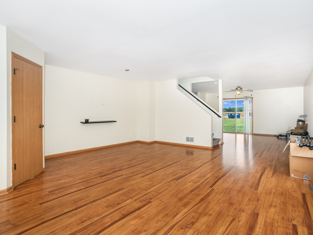 816 Kennedy Street Waterman, IL 60556 - Photo 3 of 27 a view of empty room with wooden floor