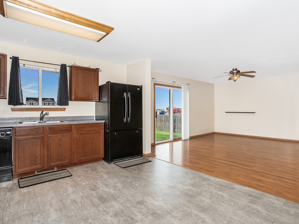 816 Kennedy Street Waterman, IL 60556 - Photo 7 of 27 a kitchen with stainless steel appliances a refrigerator and a sink