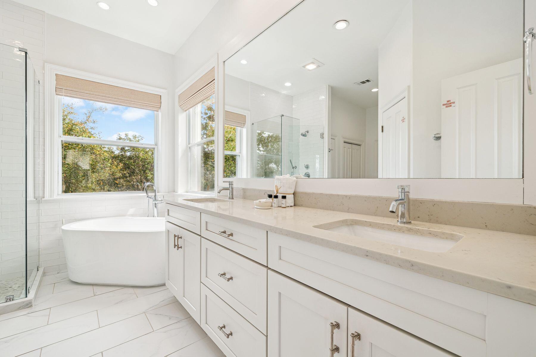 32 Hickory Street Santa Rosa Beach, FL 32459 - Photo 18 of 33 a spacious bathroom with a double vanity sink mirror and bathtub