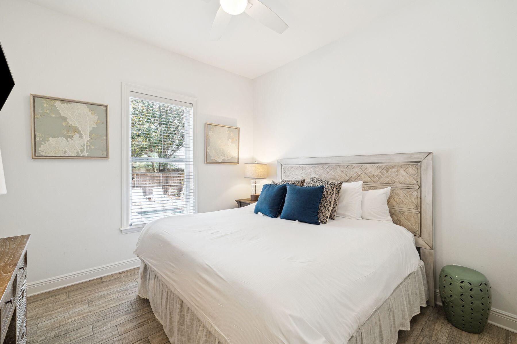 32 Hickory Street Santa Rosa Beach, FL 32459 - Photo 21 of 33 a bedroom with a bed and wooden floor