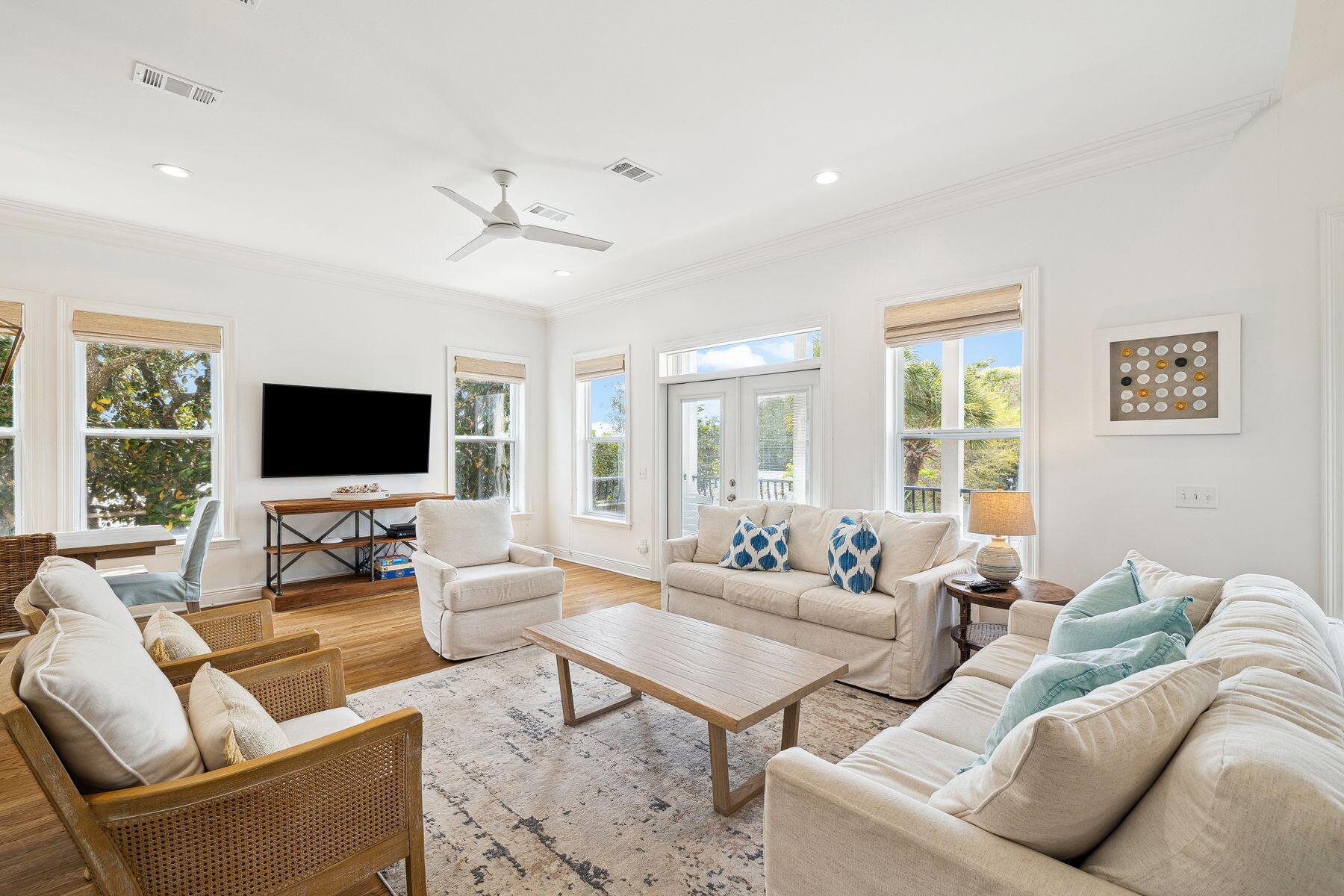 32 Hickory Street Santa Rosa Beach, FL 32459 - Photo 5 of 33 a living room with furniture a flat screen tv and a large window