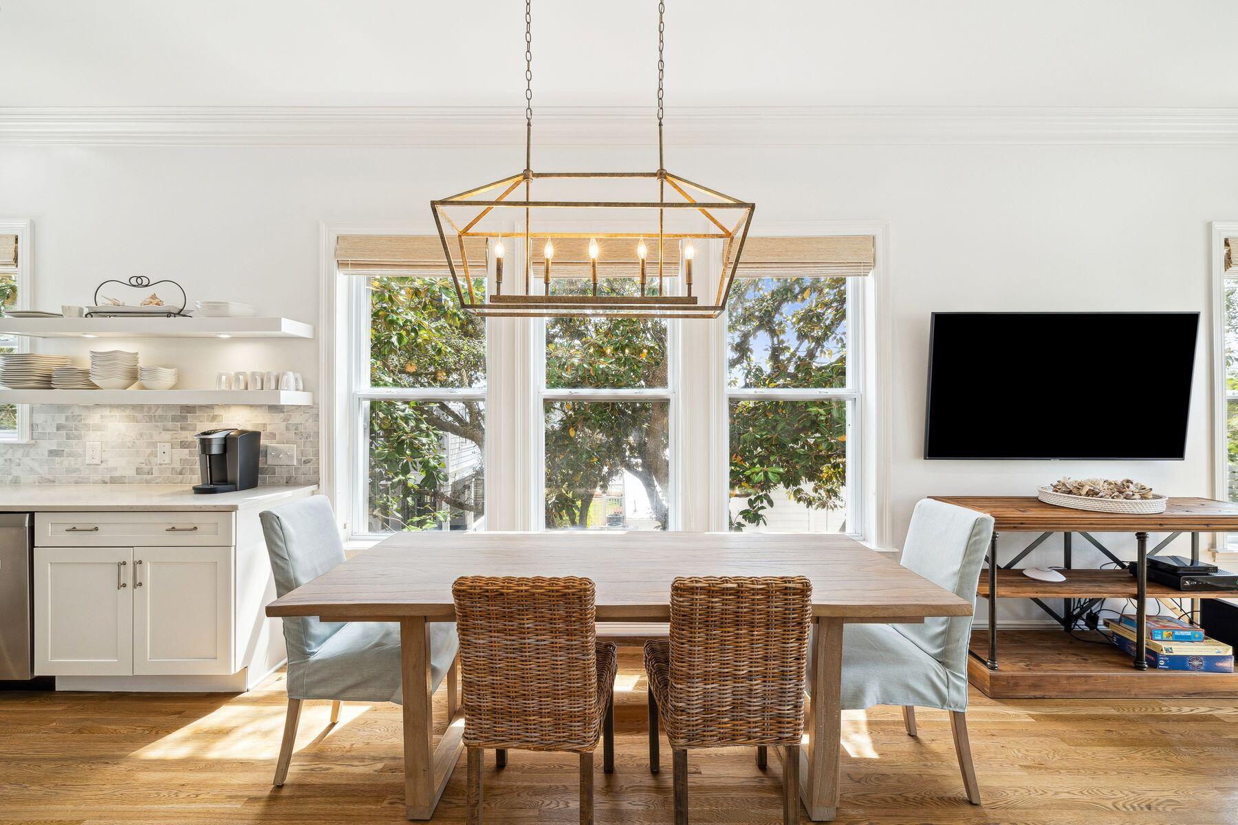 32 Hickory Street Santa Rosa Beach, FL 32459 - Photo 8 of 33 a view of a dining room with furniture wooden floor and a chandelier