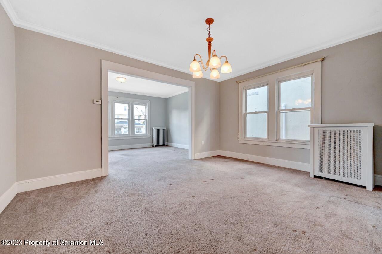 538 Wheeler Avenue Scranton, PA 18510 - Photo 12 of 65 an empty room with windows and ceiling fan