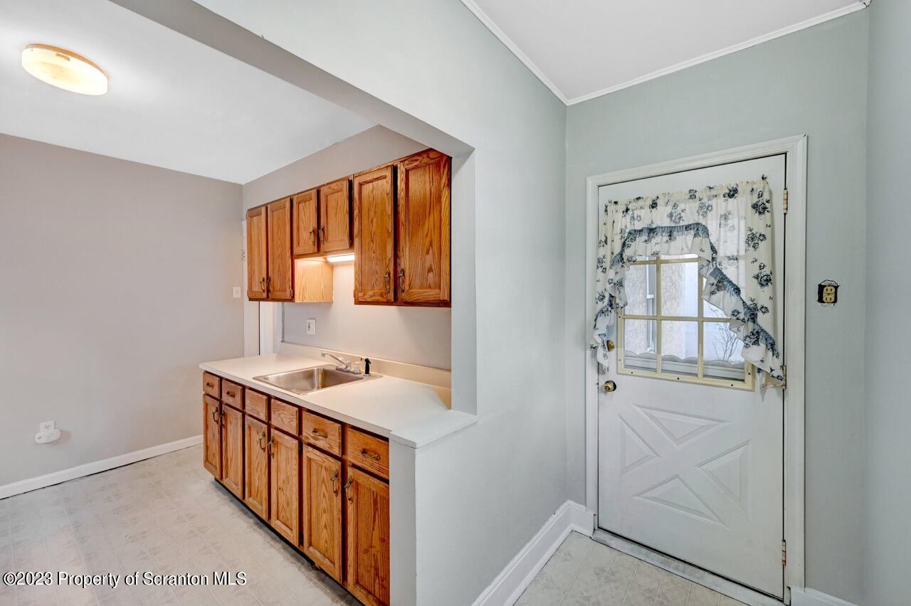 538 Wheeler Avenue Scranton, PA 18510 - Photo 19 of 65 a bathroom with a sink and a mirror