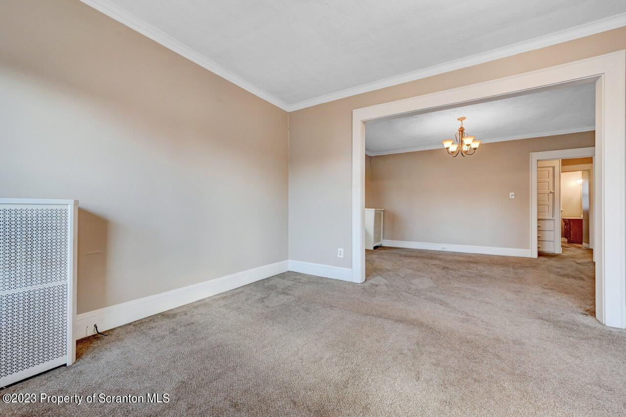 538 Wheeler Avenue Scranton, PA 18510 - Photo 33 of 65 a view of an empty room with wooden floor and a bathroom