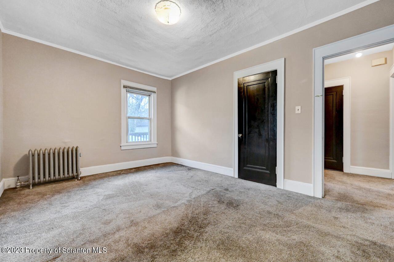 538 Wheeler Avenue Scranton, PA 18510 - Photo 50 of 65 an empty room with a window and wooden floor