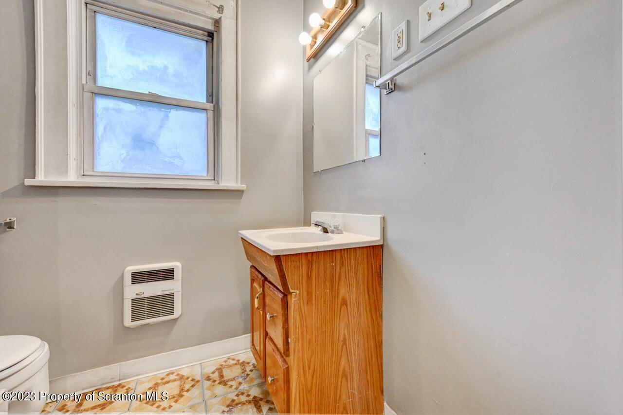 538 Wheeler Avenue Scranton, PA 18510 - Photo 53 of 65 a bathroom with a sink and a mirror