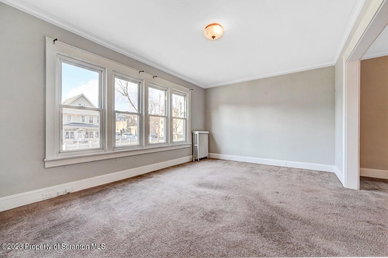 538 Wheeler Avenue Scranton, PA 18510 - Photo 9 of 65 an empty room with windows and entrance