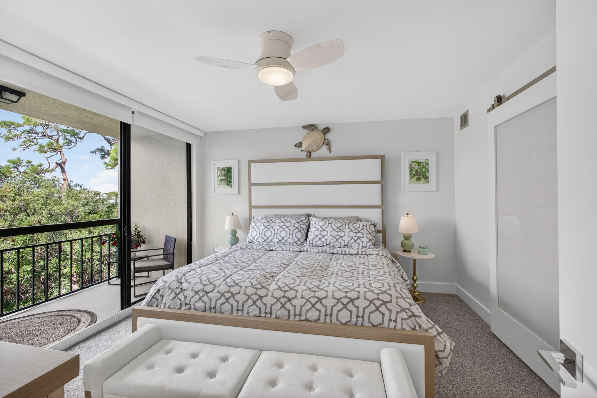1901 Marina Isle Way, Unit 304 Jupiter, FL 33477 - Photo 18 of 64 a bed sitting in a bedroom next to a window