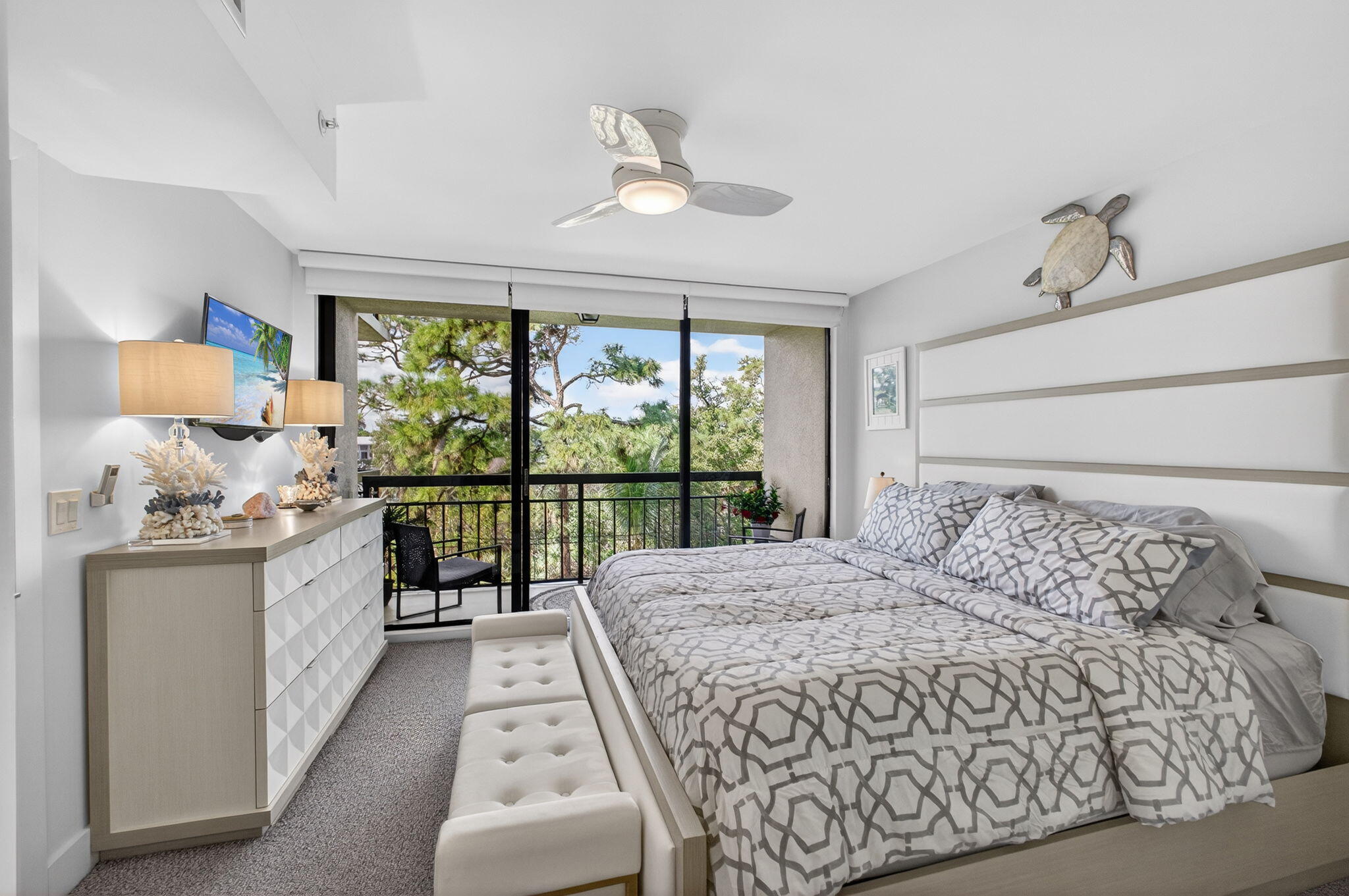 1901 Marina Isle Way, Unit 304 Jupiter, FL 33477 - Photo 19 of 64 a bed room with a bed and a large window