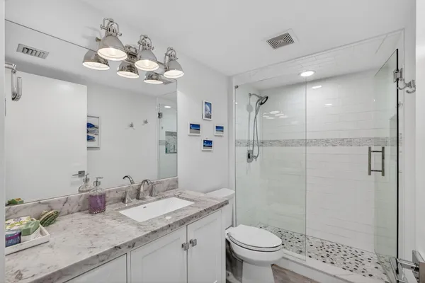 a living room with furniture and a toilet