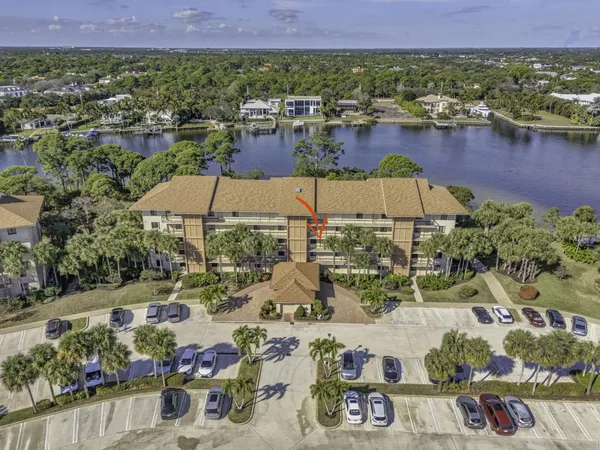 an aerial view of a house with a lake view