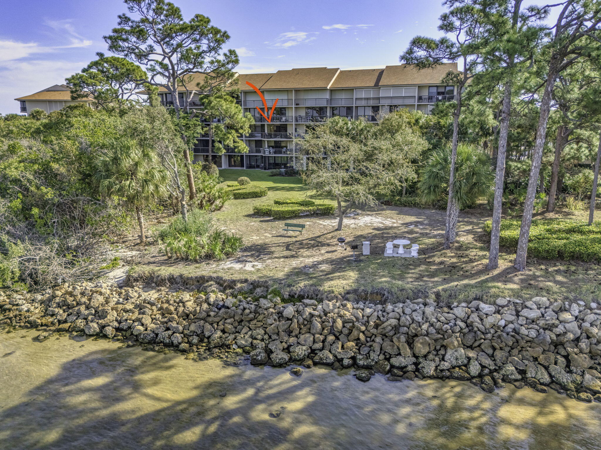 1901 Marina Isle Way, Unit 304 Jupiter, FL 33477 - Photo 51 of 64 a view of a yard with plants and trees