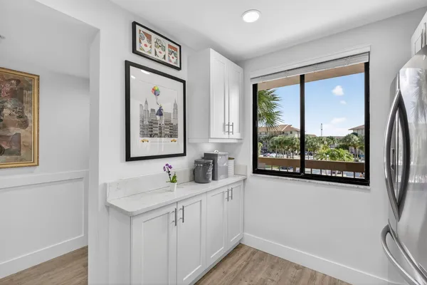 a kitchen with stainless steel appliances a sink stove and microwave
