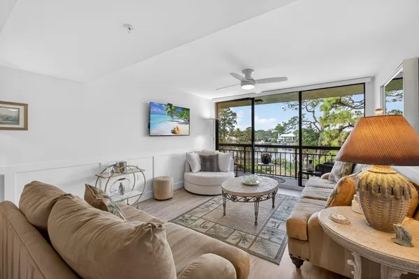 a view of a chairs and table in a balcony