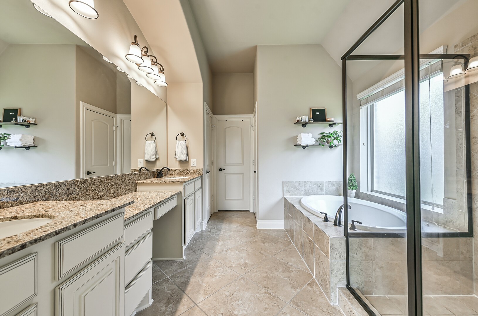 10323 Belvamera Road Richmond, TX 77407 - Photo 16 of 25 Separate standing shower and large soaking tub for the ultimate rest and relaxation.