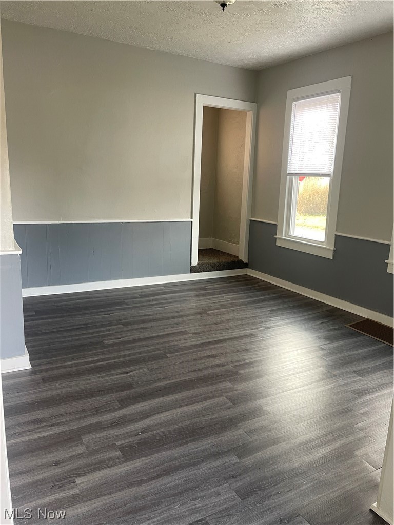 6236 Wayland Road Ravenna, OH 44266 - Photo 14 of 28 Dining room with hardwood / wood-style flooring and a textured ceiling