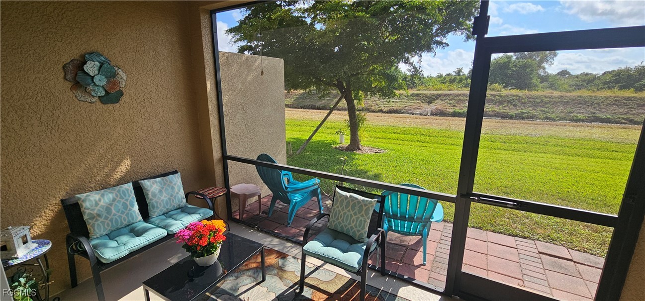 10788 Crossback Lane Lehigh Acres, FL 33936 - Photo 26 of 32 a view of a chairs and table in the balcony